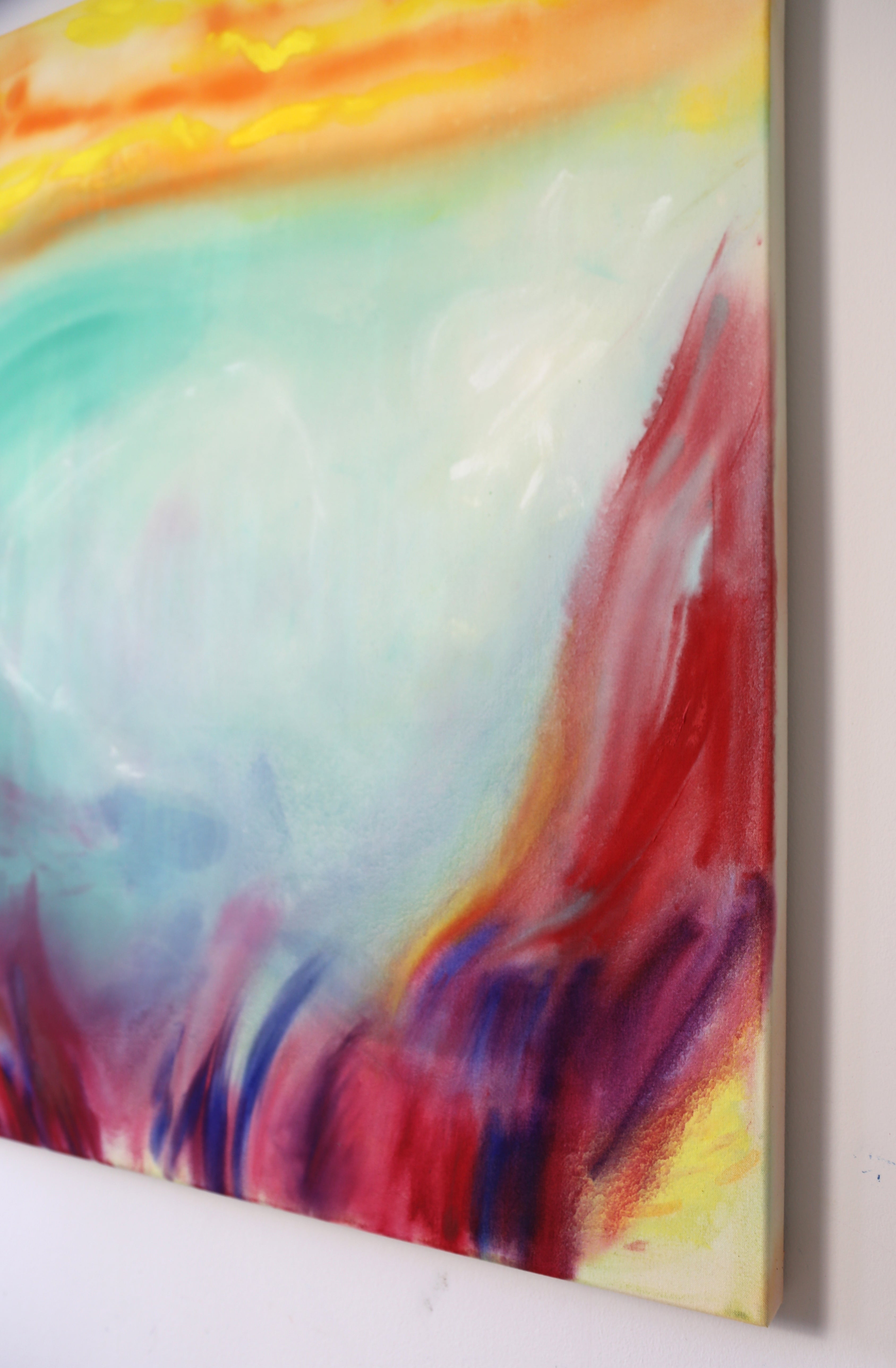 Abstract painting with vibrant colors on a white surface