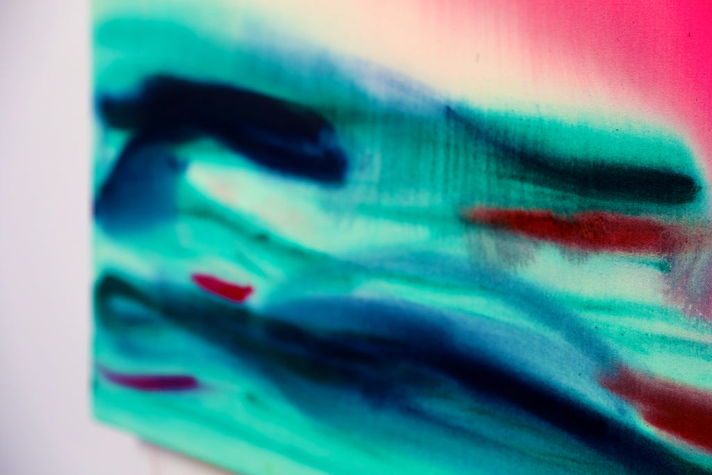 Colorful abstract art with blue, green, and red hues on a white background