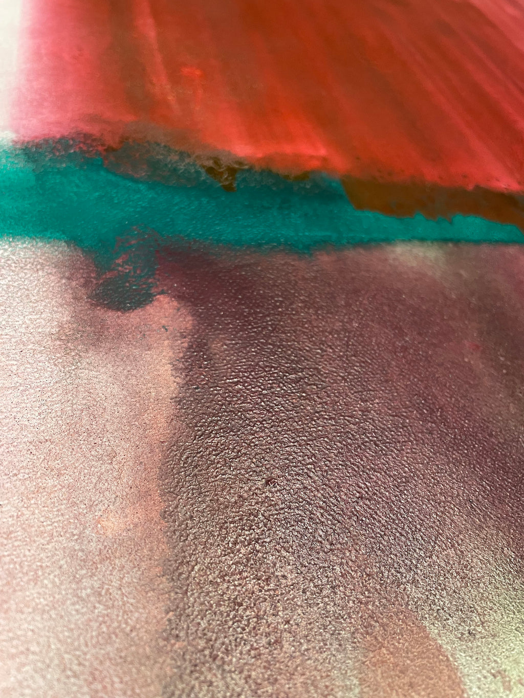 Close-up of textured fabric with red, blue, and gray colors.