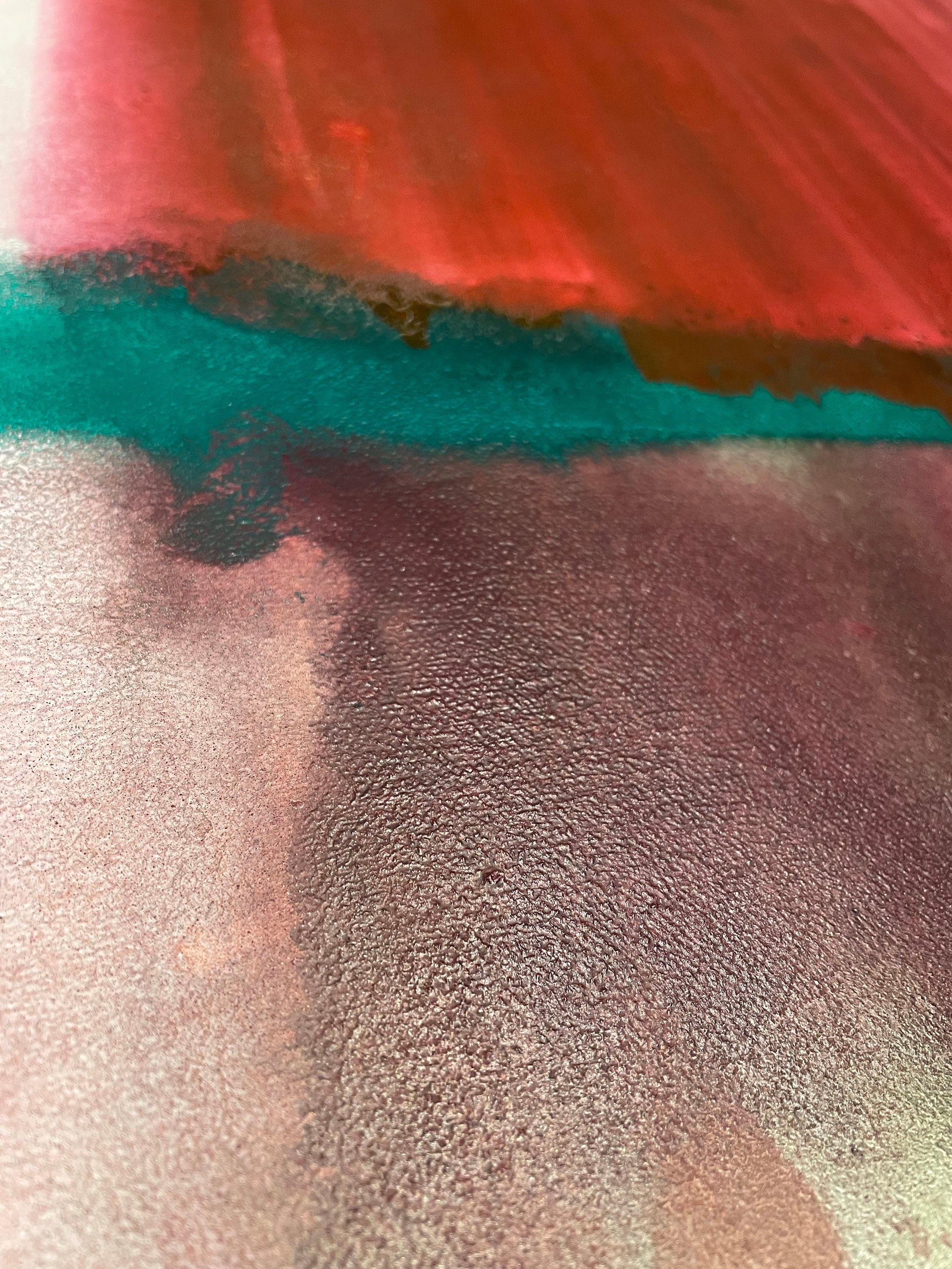 Close-up of textured fabric with red, blue, and gray colors.
