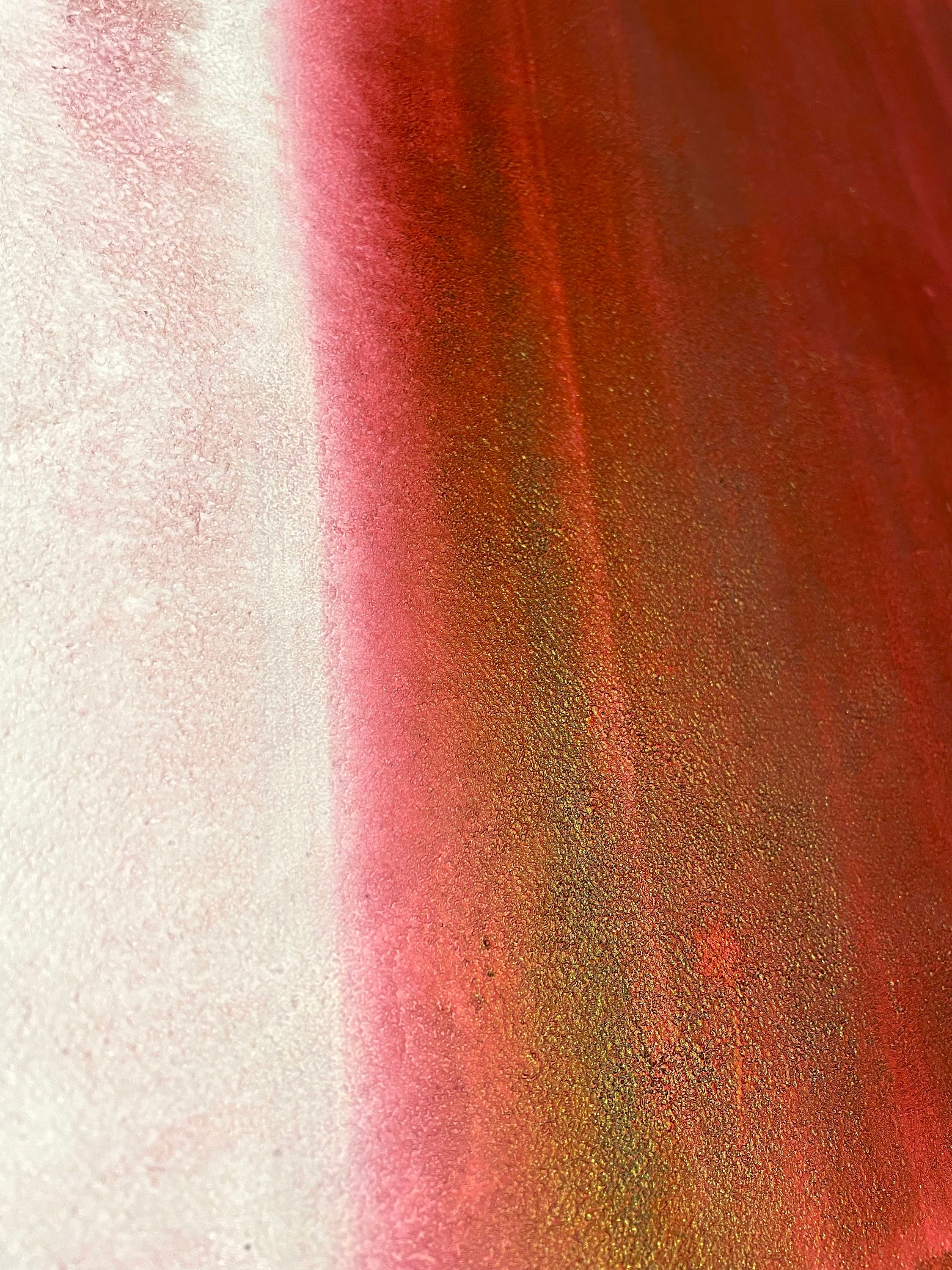 Close-up of a textured surface with red and white colors