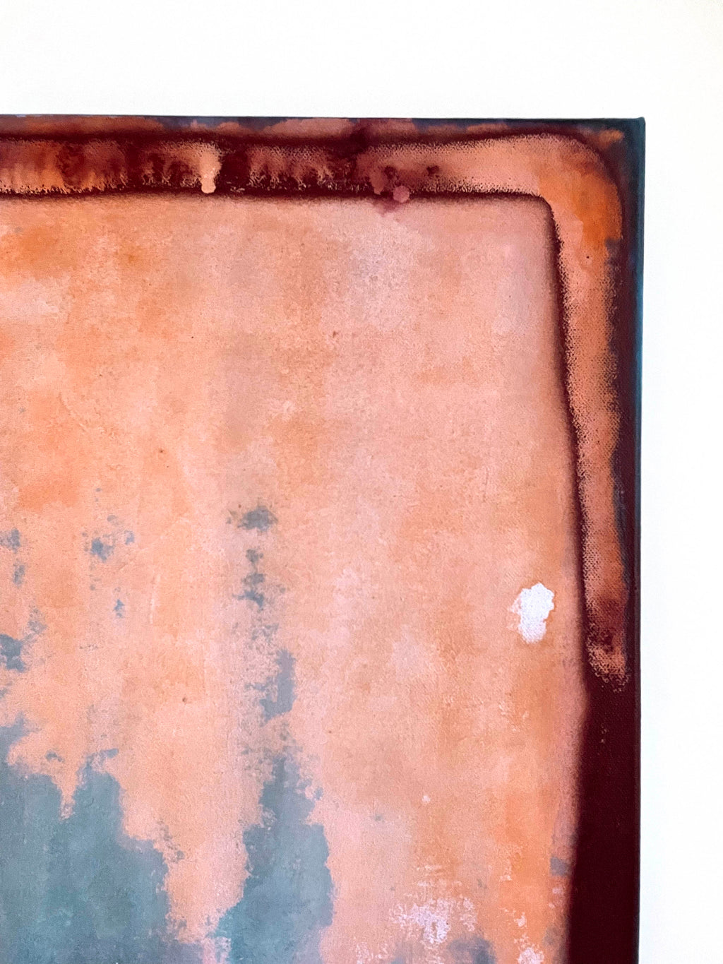 Close-up of a rusted metal surface with peeling paint