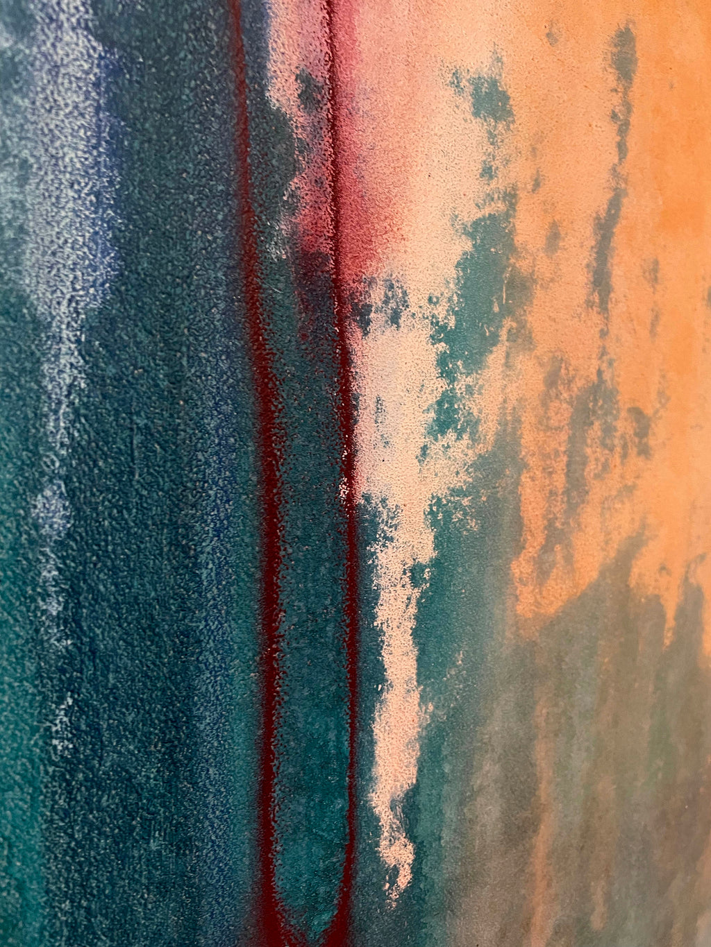 Abstract art with vertical color streaks in blue, red, and orange.