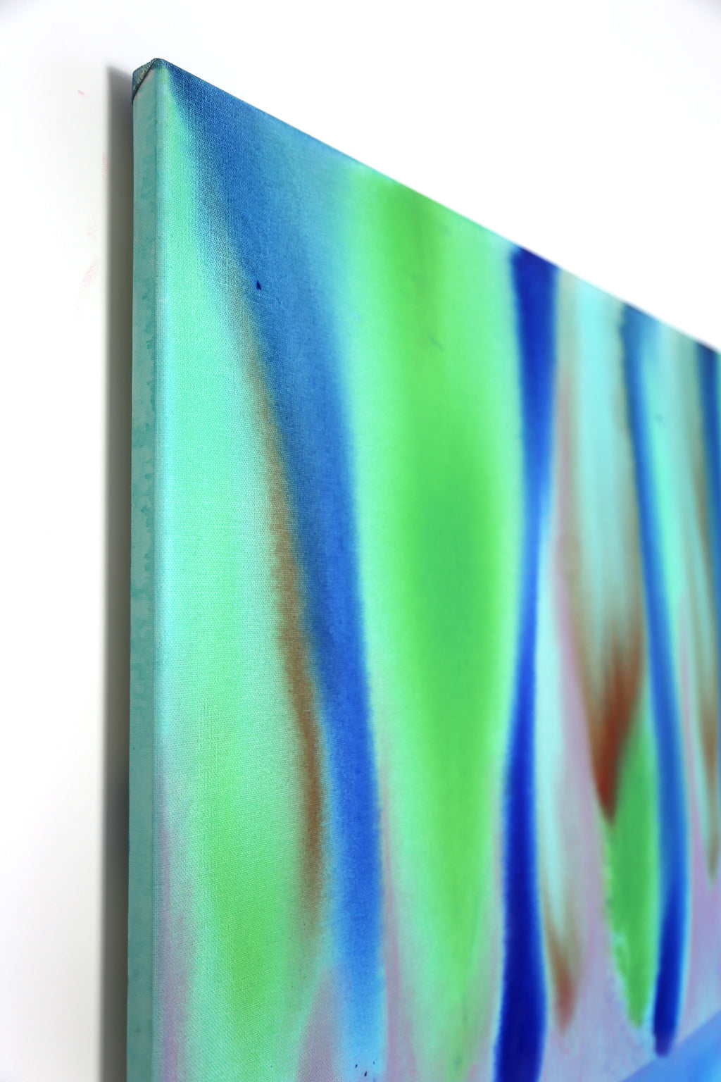 Abstract art piece with wavy patterns in green, blue, and brown on a white background