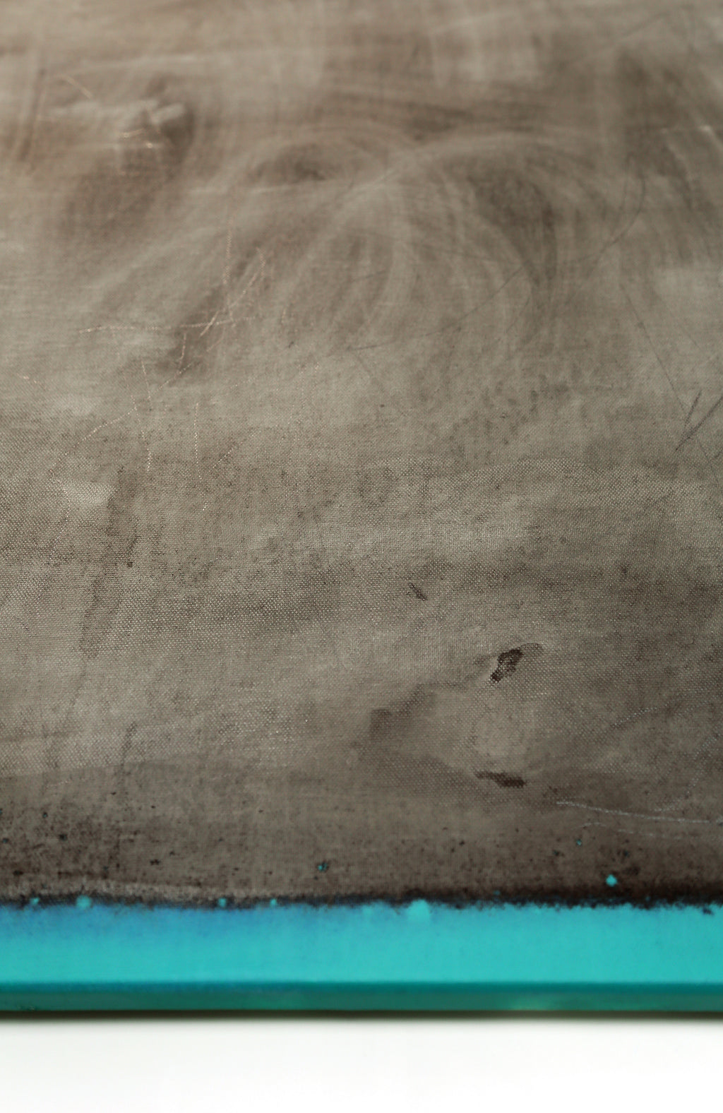 Close-up of a textured surface with a blue strip at the bottom