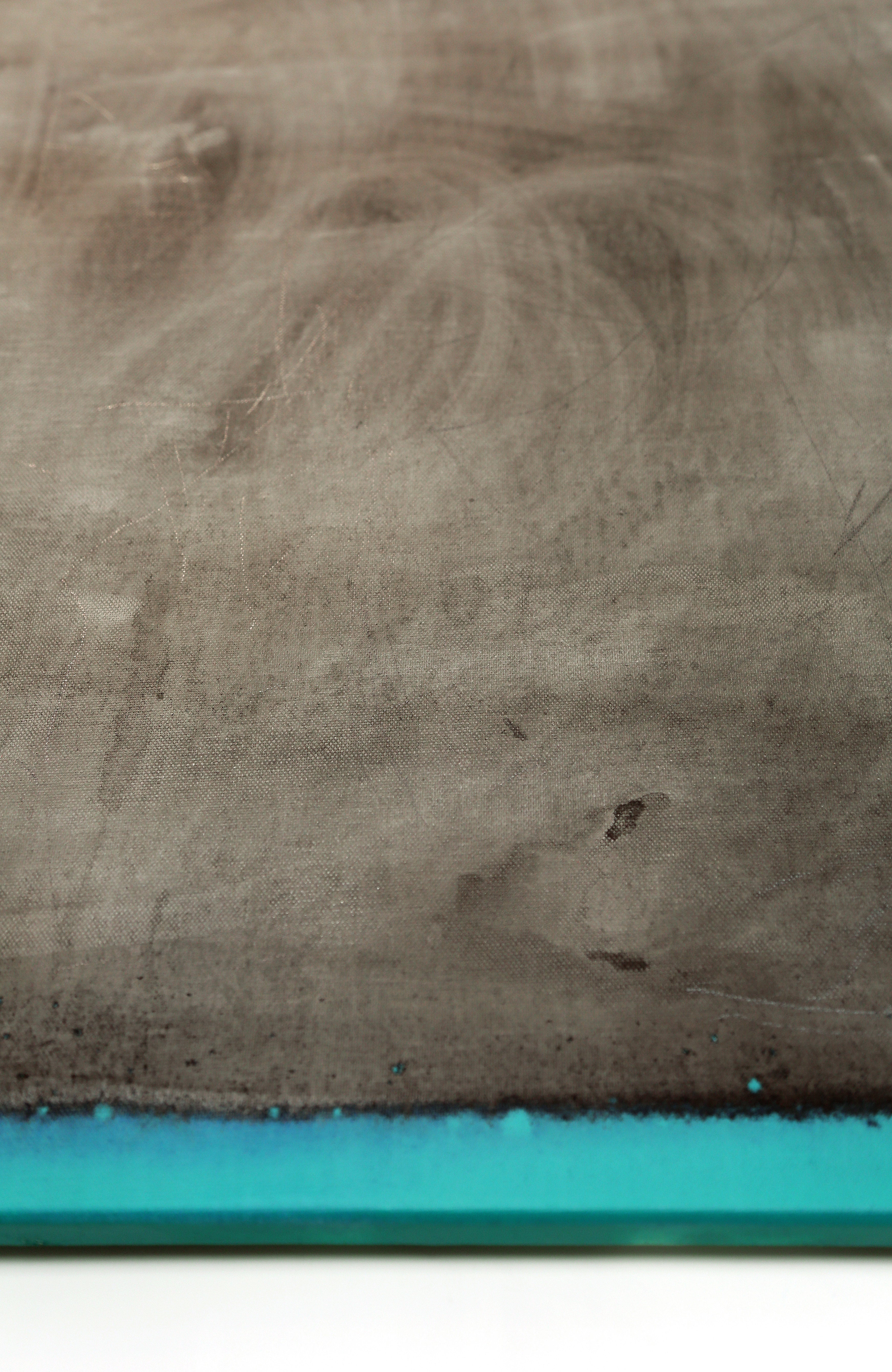 Close-up of a textured surface with a blue strip at the bottom