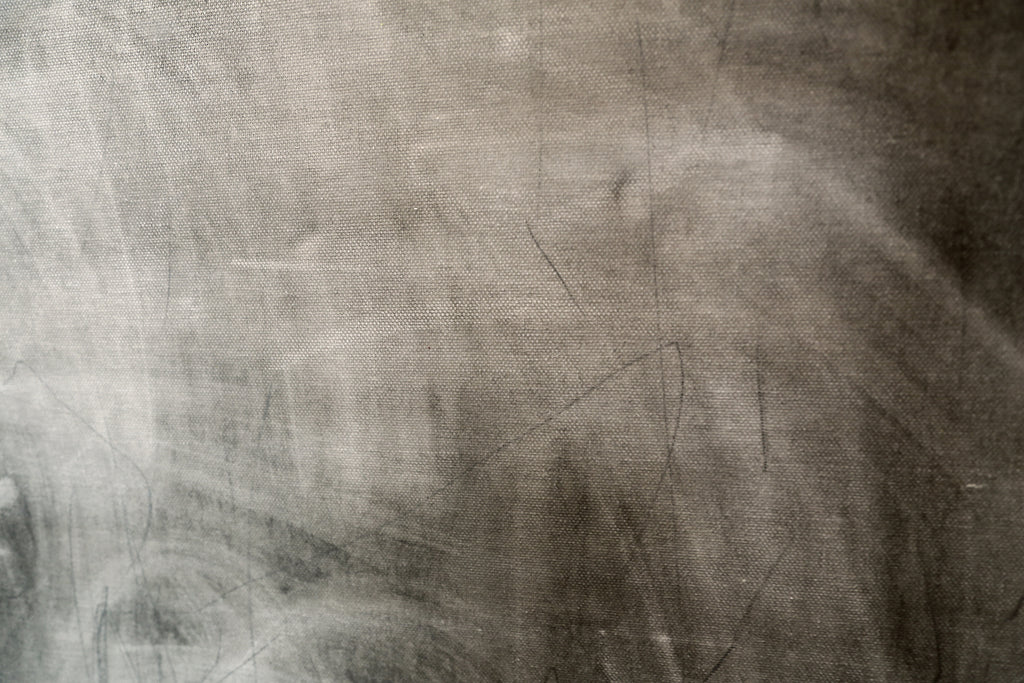 Abstract art with blurred figures and geometric shapes on a textured surface