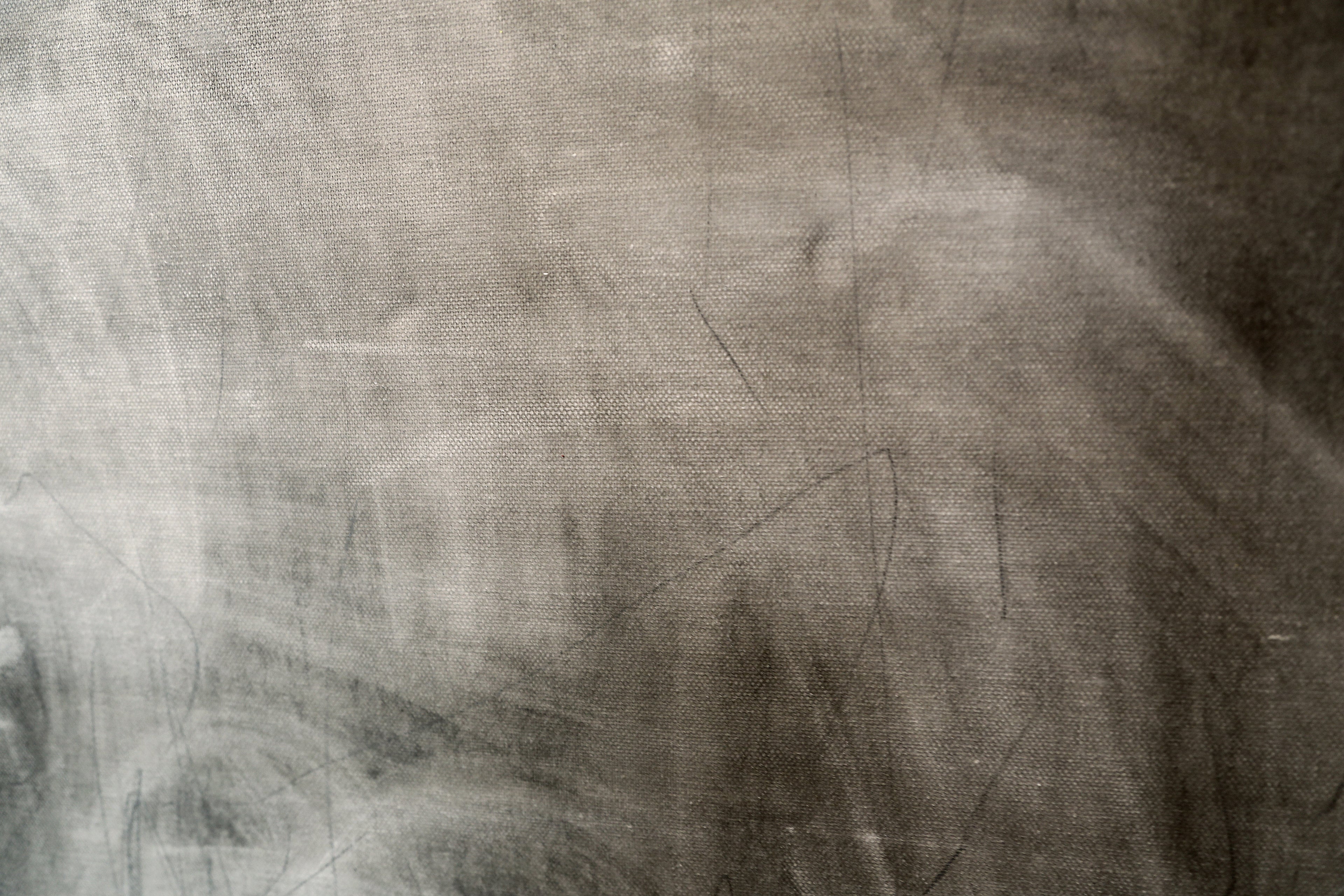 Abstract art with blurred figures and geometric shapes on a textured surface